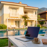 Laptop and Turkish coffee on a villa terrace overlooking the pool — workation in Göcek